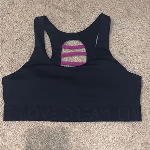 Sports bra with pink caged detailing on the back!
